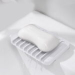 LYCAQL Self Draining Soap Dishes, 2 Pcs Silicone Soap Saver, Waterfall Drainer Soap Holder for Bathroom, Extend Soap Life, Keep Soap Bars Dry Clean & Easy Cleaning (White, Black)